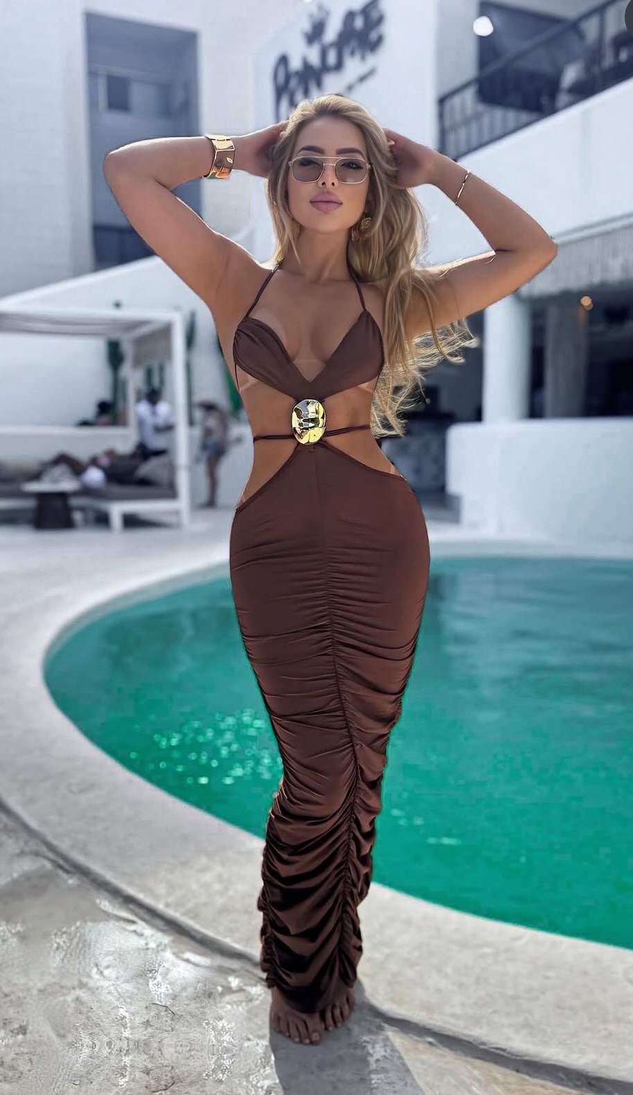 Sofia Ferrari — chocolate ruched gown, poolside luxury
